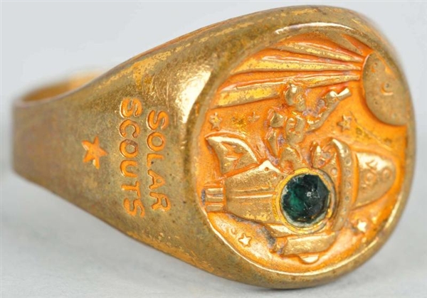 BUCK ROGERS REPELLER RAY RING WITH GREEN STONE.   