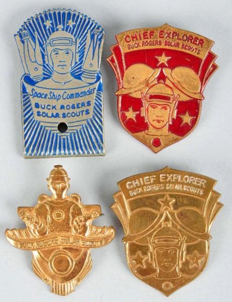 LOT OF 4: BUCK ROGERS SOLAR SCOUT BADGES.         