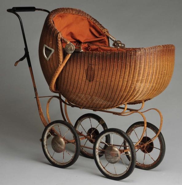 “SHIRLEY TEMPLE” WICKER DOLL CARRIAGE.            