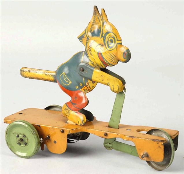 TIN CHEIN CRAZY CAT SCOOTER WIND-UP TOY.          