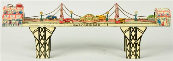 TIN LITHO MARX BUSY BRIDGE WIND-UP TOY.           