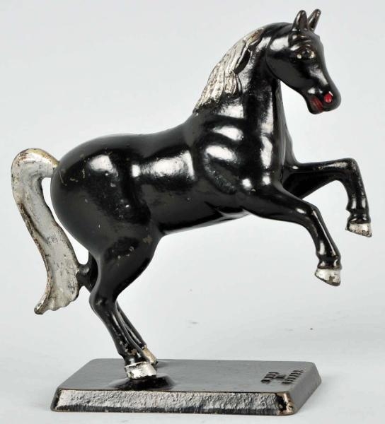 CAST IRON "MADE IN CANADA" HORSE STILL BANK.      