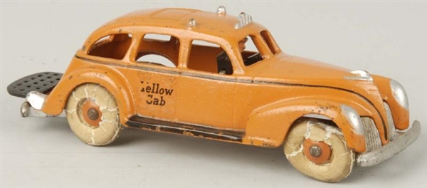 CAST IRON HUBLEY YELLOW CAB TOY.                  