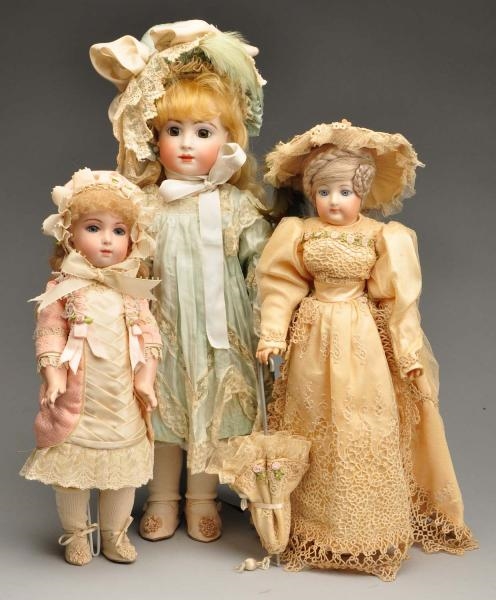 LOT OF 3: REPRODUCTIONS OF FRENCH BISQUE DOLLS.   