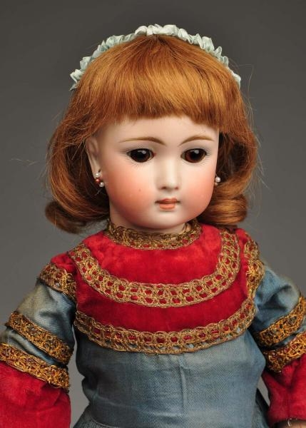 EARLY GERMAN BISQUE CHILD DOLL.                   