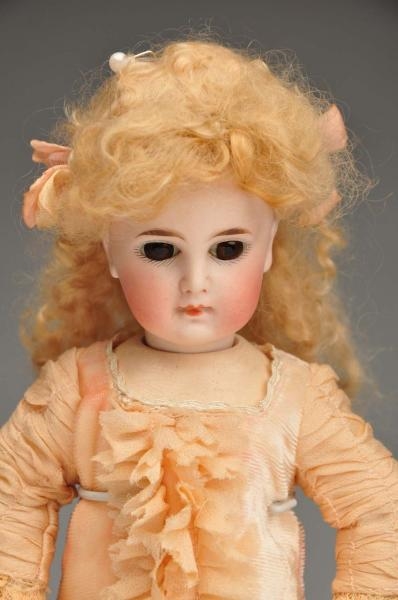 EARLY GERMAN BISQUE CHILD DOLL.                   