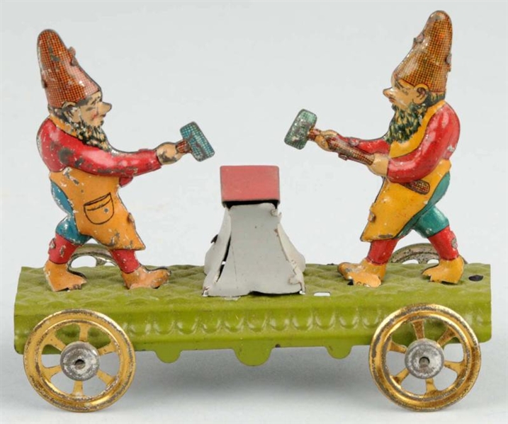 TIN LITHO GNOMES HAMMERING ANVIL PENNY TOY.       