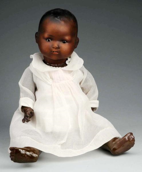 BLACK GERMAN BISQUE CHARACTER BABY DOLL.          
