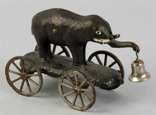 CAST IRON ELEPHANT WITH SWIVEL TRUNK BELL TOY.    
