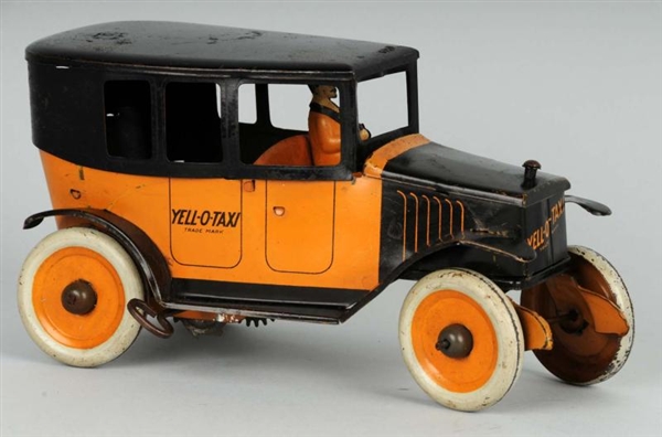 TIN STRAUSS YELLOW TAXI WIND-UP TOY.              
