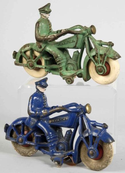 LOT OF 2: CAST IRON CHAMPION POLICEMEN CYCLE TOYS 