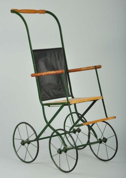 ANTIQUE WOOD AND METAL DOLL STROLLER.             
