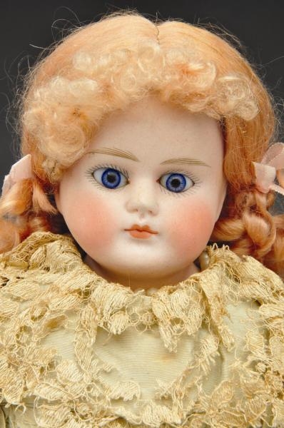 EARLY CLOSED MOUTH GERMAN BISQUE CHILD DOLL.      