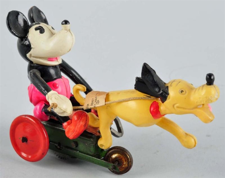CELLULOID MICKEY IN CART PULLED BY PLUTO TOY.     