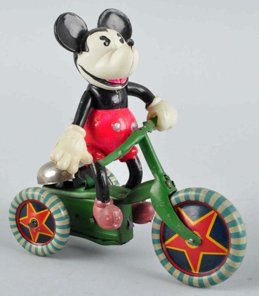CELLULOID MICKEY RIDING TRICYCLE WIND-UP TOY.     