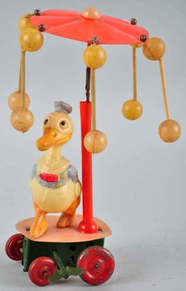 CELLULOID DONALD DUCK WHIRLIGIG WIND-UP TOY.      