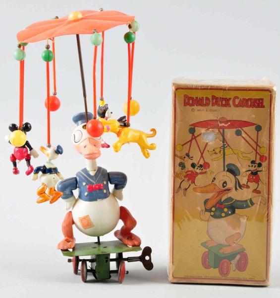 CELLULOID DISNEY DONALD DUCK CAROUSEL WIND-UP TOY 