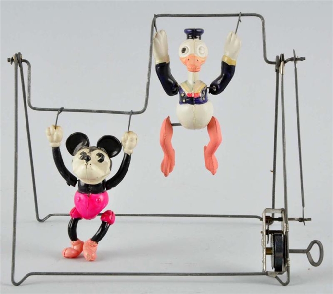 CELLULOID MICKEY & DONALD TRAPEZE WIND-UP TOY.    