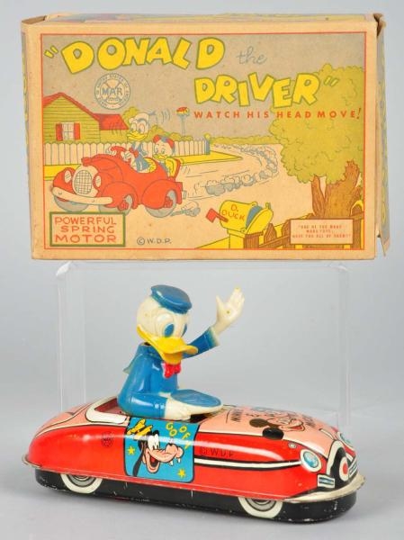 TIN MARX DISNEY DONALD THE DRIVER WIND-UP TOY.    