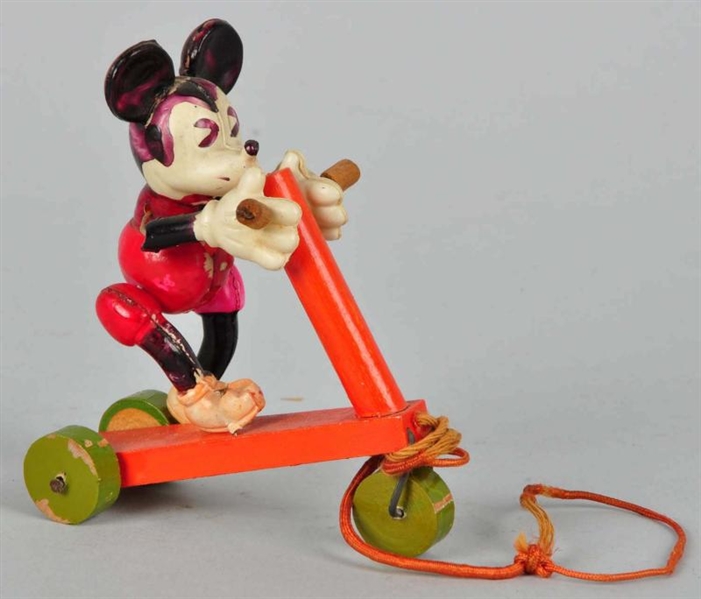 CELLULOID DISNEY MICKEY ON WOOD SCOOTER TOY.      