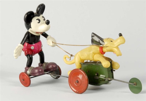 CELLULOID MICKEY IN CART PULLED BY PLUTO TOY.     