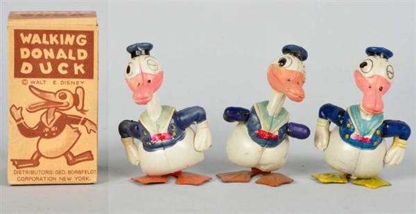 LOT OF 3: CELLULOID DISNEY DONALD WIND-UP TOYS.   