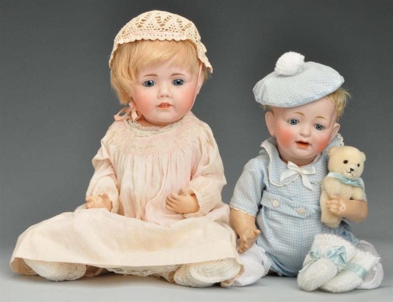 LOT OF 2: BABY DOLLS WITH BISQUE HEADS.           
