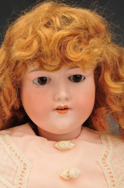 GERMAN BISQUE CHILD DOLL WITH RARE LONG TAIL WIG. 