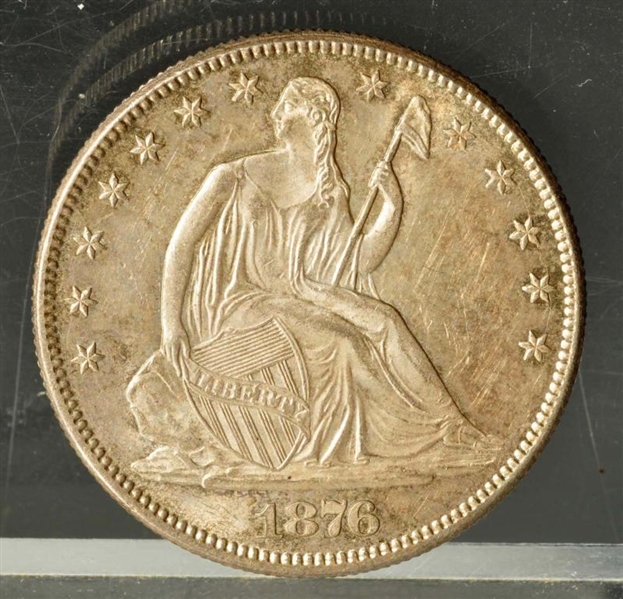 1876 SEATED LIBERTY HALF DOLLAR WITH MOTTO.       