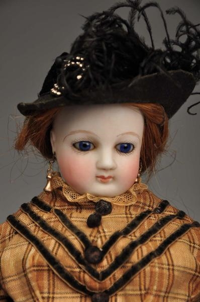EARLY FRENCH BISQUE FASHION DOLL.                 