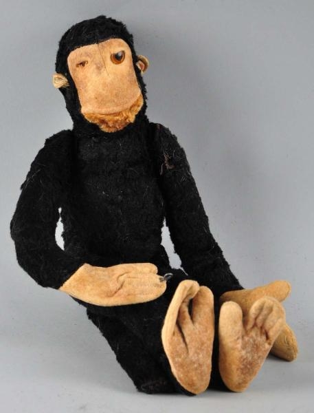 STRAW-STUFFED MONKEY TOY.                         