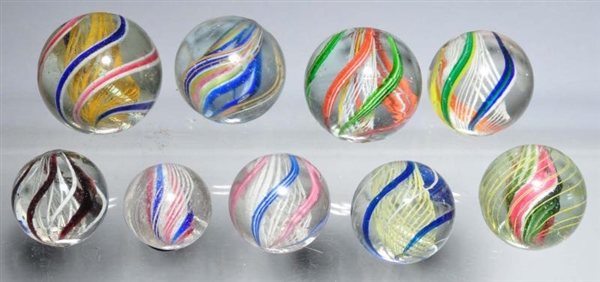 LOT OF 9: SWIRL MARBLES.                          