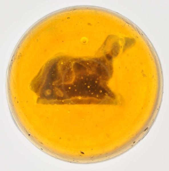AMBER GLASS DOG SULPHIDE MARBLE.                  