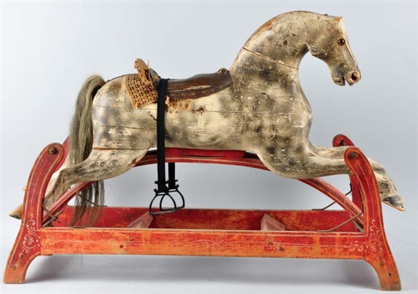EARLY WOODEN ROCKING HORSE TOY.                   