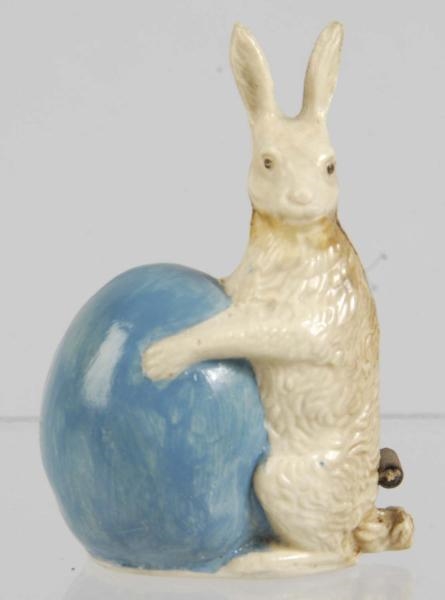 BUNNY HOLDING EGG FIGURAL SEWING TAPE MEASURE.    