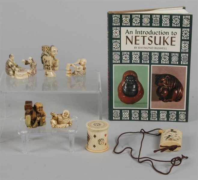 LOT OF 8: NETSUKE FIGURES & BOOK.                 