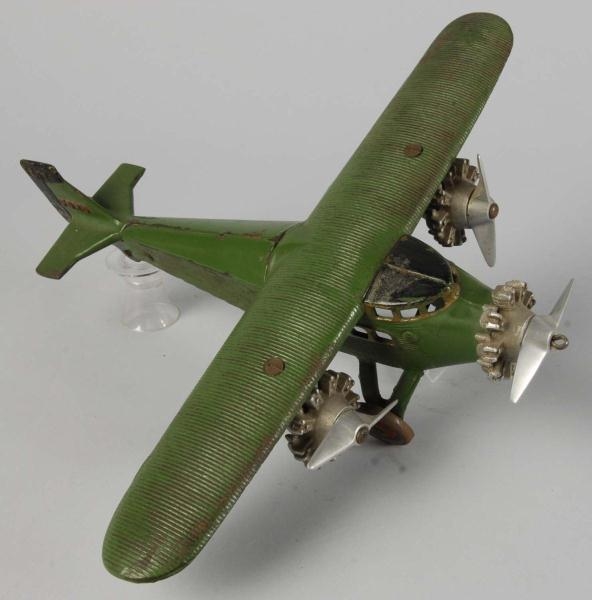 CAST IRON DENT FORD TRI-MOTOR AIRPLANE TOY.       