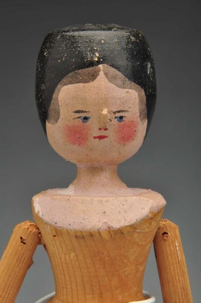 LATE 1890S JOINTED WOODEN DOLL.                   