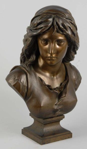 BRONZE BUST OF A WOMAN.                           