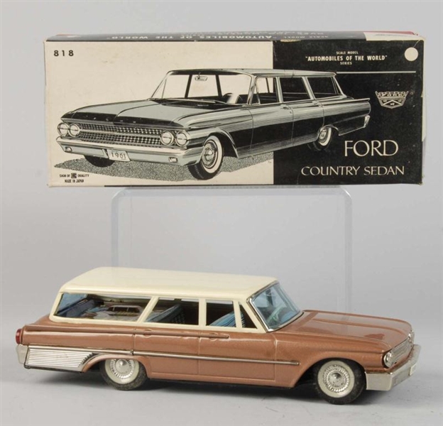 TIN LITHO FORD STATION WAGON FRICTION TOY.        