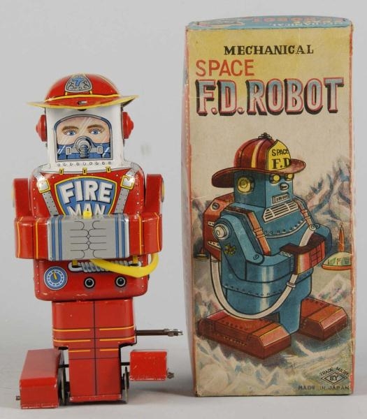 TIN LITHO FIRE DEPARTMENT ROBOT WIND-UP TOY.      