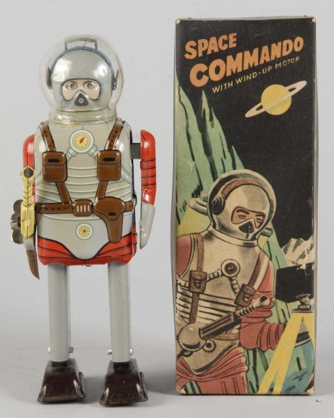 TIN LITHO SPACE COMMANDO ASTRONAUT WIND-UP TOY.   