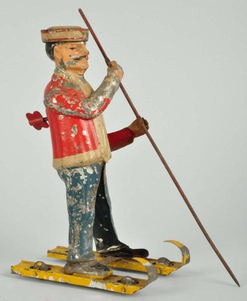 HANDPAINTED TIN SKIER WIND-UP TOY.                