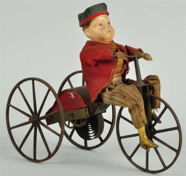 EARLY TIN GEORGE BROWN BOY ON VELOCIPEDE TOY.     