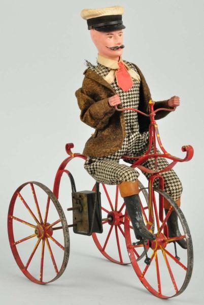 EARLY TIN BICYCLE CLOCKWORK TOY.                  