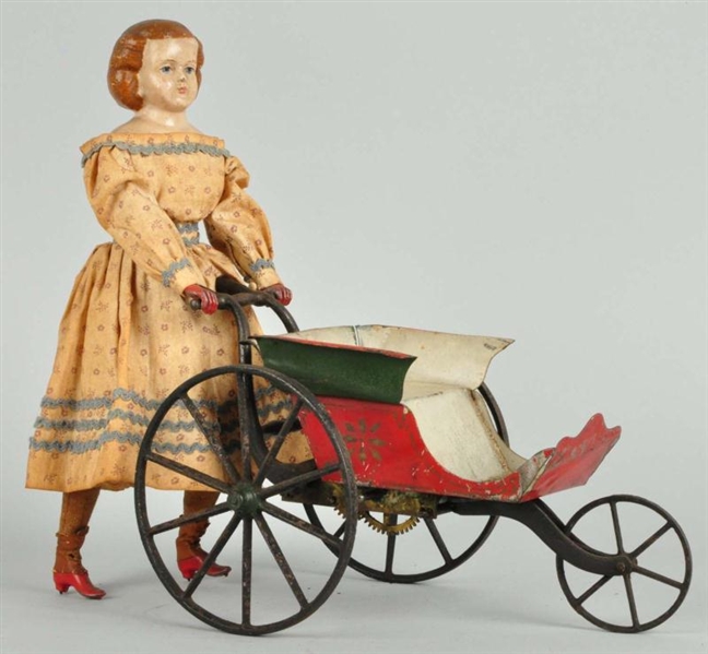 EARLY TIN GOODWIN WALKING DOLL TOY.               