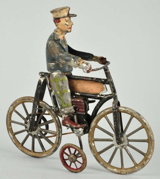 HANDPAINTED TIN MOTORCYCLE WIND-UP TOY.           