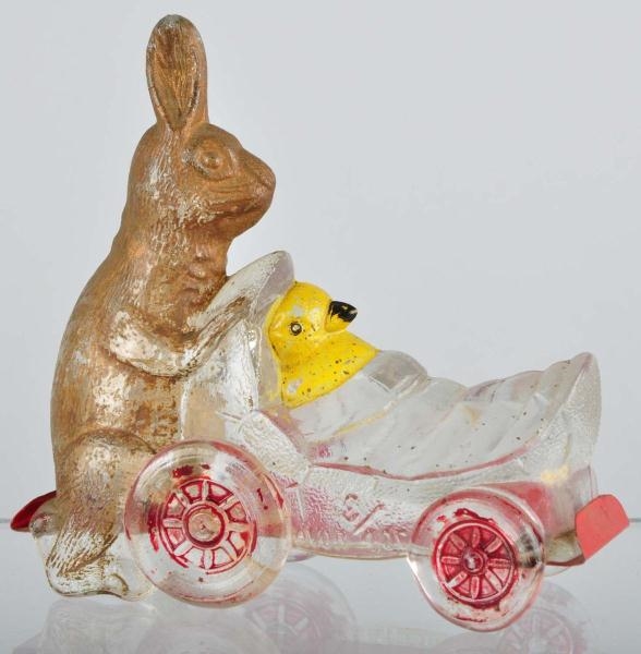 GLASS RABBIT PUSHING CHICK CANDY CONTAINER.       