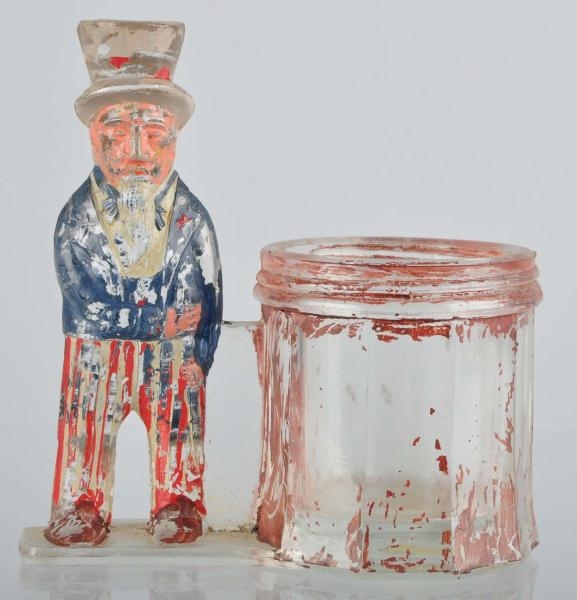 PAINTED GLASS UNCLE SAM CANDY CONTAINER.          