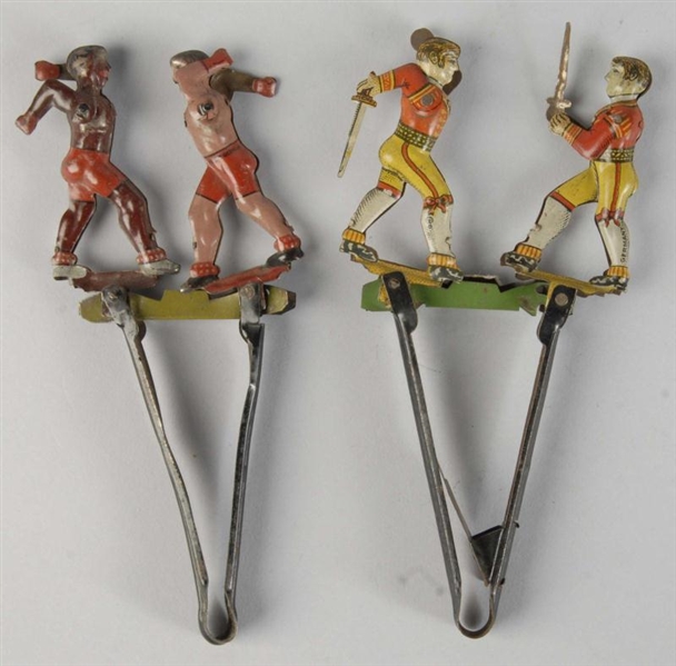 LOT OF 2: TIN LITHO FIGURAL SQUEEZE PENNY TOYS.   
